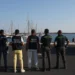Una motovedetta della Guardia Costiera attraccata al porto di Pozzallo durante le operazioni di sbarco