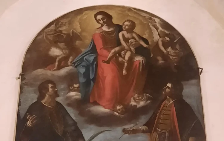 Intervento di restauro Minniti a Modica sulla tela della Madonna con i Santi Cosma e Damiano.