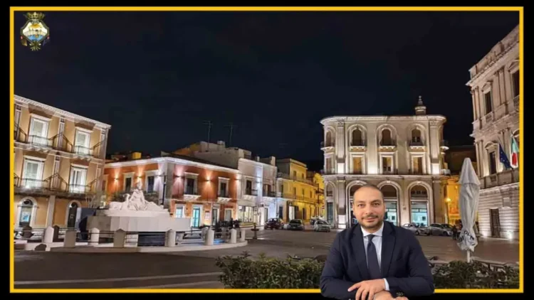 Centro storico di Comiso con attività commerciali e strada urbana