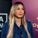 Diletta Leotta con una giacca di jeans scura durante un'intervista, con sfondo loghi DAZN e AC Milan.