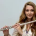 Auditorium con pianoforte a coda e flauto sul palco in attesa del concerto di Melodica a Ragusa