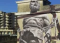 Murale del progetto Bitume sull’ex area industriale Ancione a Ragusa, simbolo della memoria produttiva della città