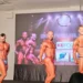 Daniele Spadola sul palco dei Campionati Italiani di Bodybuilding durante una posa nella categoria Open.
