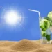 Bicchiere con lime e menta su sabbia, accanto a un termometro che segna oltre 40°C, cielo azzurro con sole intenso