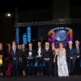I premiati, i presentatori e gli organizzatori del Premio Ragusani nel Mondo posano sul palco della 31ª edizione in piazza Libertà a Ragusa, davanti al grande ledwall della manifestazione.