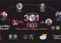 Locandina "Ragusani nel Mondo 2026" con i sei premiati e il logo Cioccolato di Modica IGP, Piazza Libertà Ragusa