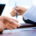 Firma di documenti durante una procedura amministrativa per l'acquisizione di un immobile destinato al Centro per l'Impiego di Vittoria.