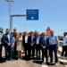 Autorità e tecnici durante l'inaugurazione del nuovo svincolo Misterbianco Nord sulla Tangenziale di Catania, sotto il nuovo cartello stradale