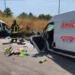 Un vigile del fuoco tra i due furgoni distrutti dopo lo scontro frontale sulla provinciale Valguarnera-Dittaino