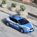 Volante della Polizia di Stato parcheggiata in una piazza di Modica, ripresa dall'alto con fichi d'india sullo sfondo