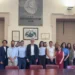 Gruppo di circa quindici persone in piedi in una sala istituzionale del Comune di Ragusa, durante l'ingresso in servizio dei nuovi professionisti del Distretto 44.