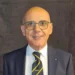Sergio Cassisi, presidente del Comitato provinciale Csen Ragusa, in giacca scura e cravatta con logo Csen