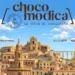 Illustrazione del centro storico di Modica con il logo ChocoModica 2026 e le date dell'evento, 30 ottobre-1 novembre