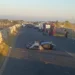 Scooter incidentato sull'asfalto dopo un incidente stradale a Modica, con carabinieri e mezzi di soccorso sul posto