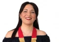 Michela Canto sorride con la fascia e i distintivi da presidente del Rotaract Club Pozzallo-Ispica