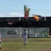 Giocatori del Modica in campo durante la trasferta di Sambiase, tifosi con bandiere sugli spalti