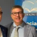 Giovanni Frasca, presidente Anc Ragusa, in posa con un collega davanti al banner dell'Associazione nazionale commercialisti