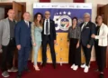 Sette dirigenti del Csen Ragusa in posa davanti al pannello dei 50 anni del Centro sportivo educativo nazionale
