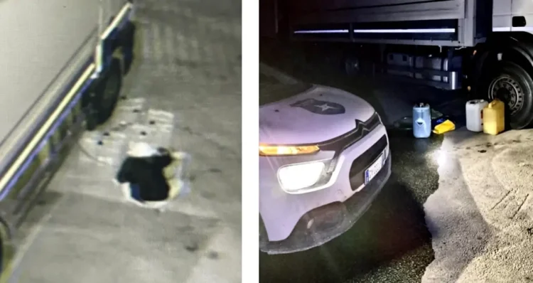 Camion in sosta di notte e telecamera di sorveglianza in un piazzale
