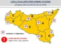Mappa della Sicilia divisa in zone di allerta dalla A alla I, tutte in giallo, con simboli di temporali per il maltempo del 10 ottobre
